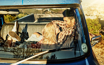 Buy stock photo Shot of a young couple out on a road trip with their truck