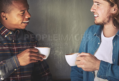 Buy stock photo Shot of two friends having coffee together in a coffee shop