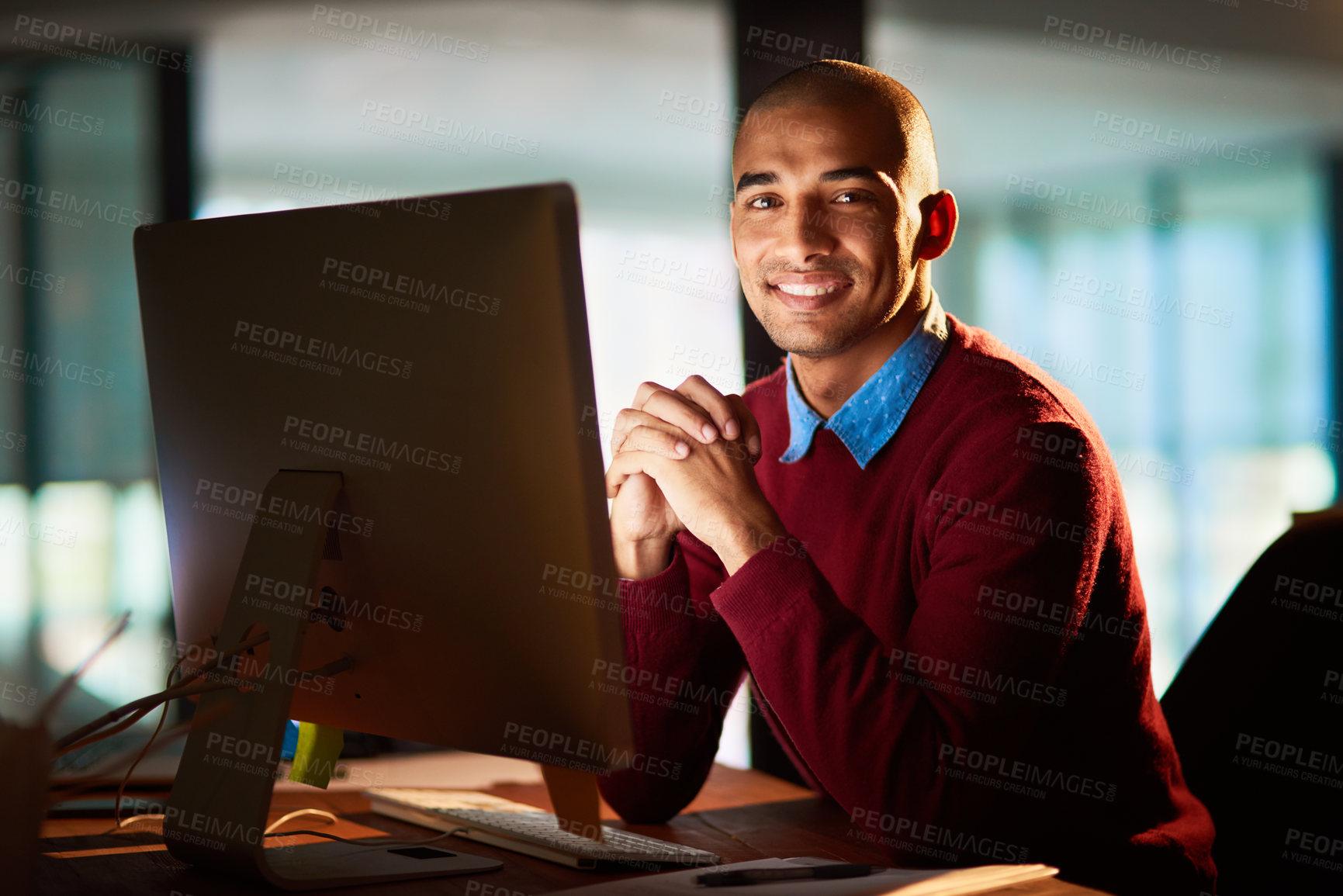 Buy stock photo Portrait of a handsome young man working late in his office