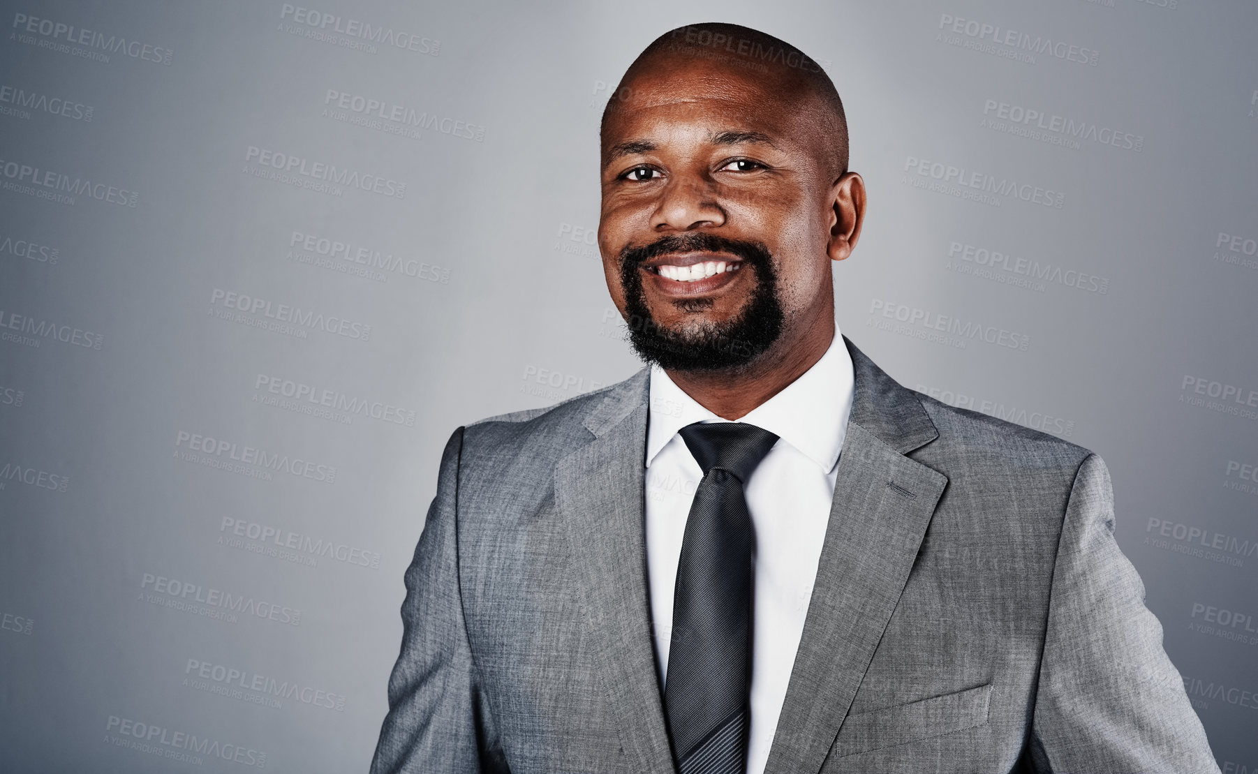 Buy stock photo Studio, black man and portrait with smile for solution, law firm and legal advice for court case. Mockup space, business employee and lawyer with pride for justice, corporate job and gray background