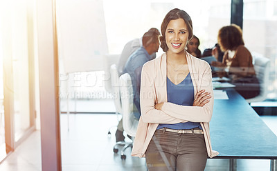 Buy stock photo Shot of a businesswoman posing with her arms crossed in a boardroom