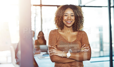 Buy stock photo Shot of a businesswoman posing with her arms crossed in a boardroom