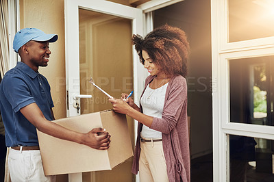 Buy stock photo Cropped shot of an attractive young woman signing for a home delivery