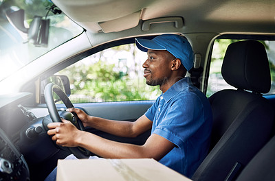 Buy stock photo Shot of a young postal working sitting in his car during a delivery