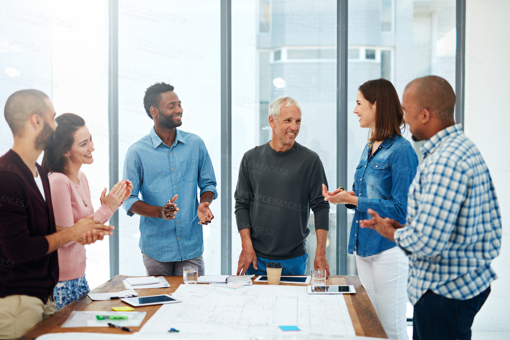 Buy stock photo Business people, architect and applause in office for success of building project with blueprint and diversity. Architecture, employees or collaboration with clapping hands in boardroom for proposal