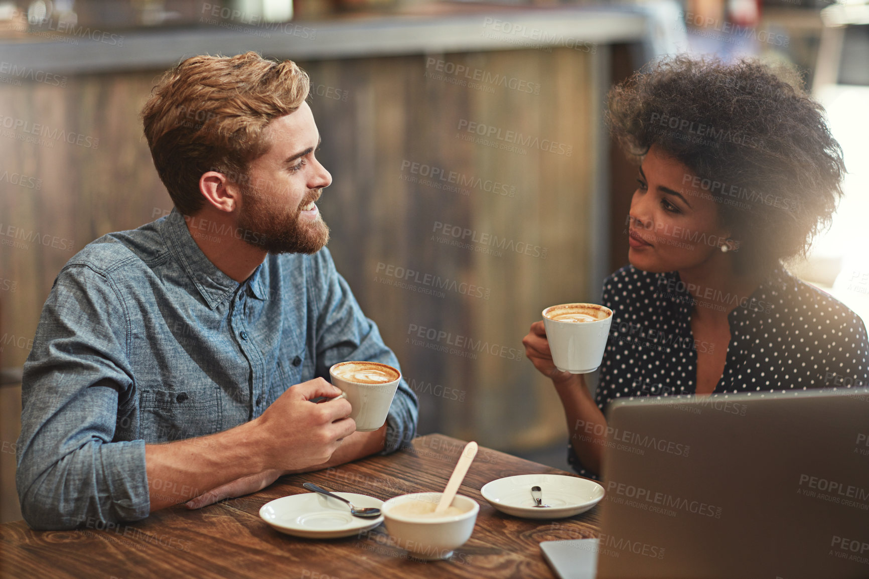 Buy stock photo Cropped shot of a young couple on a coffee date