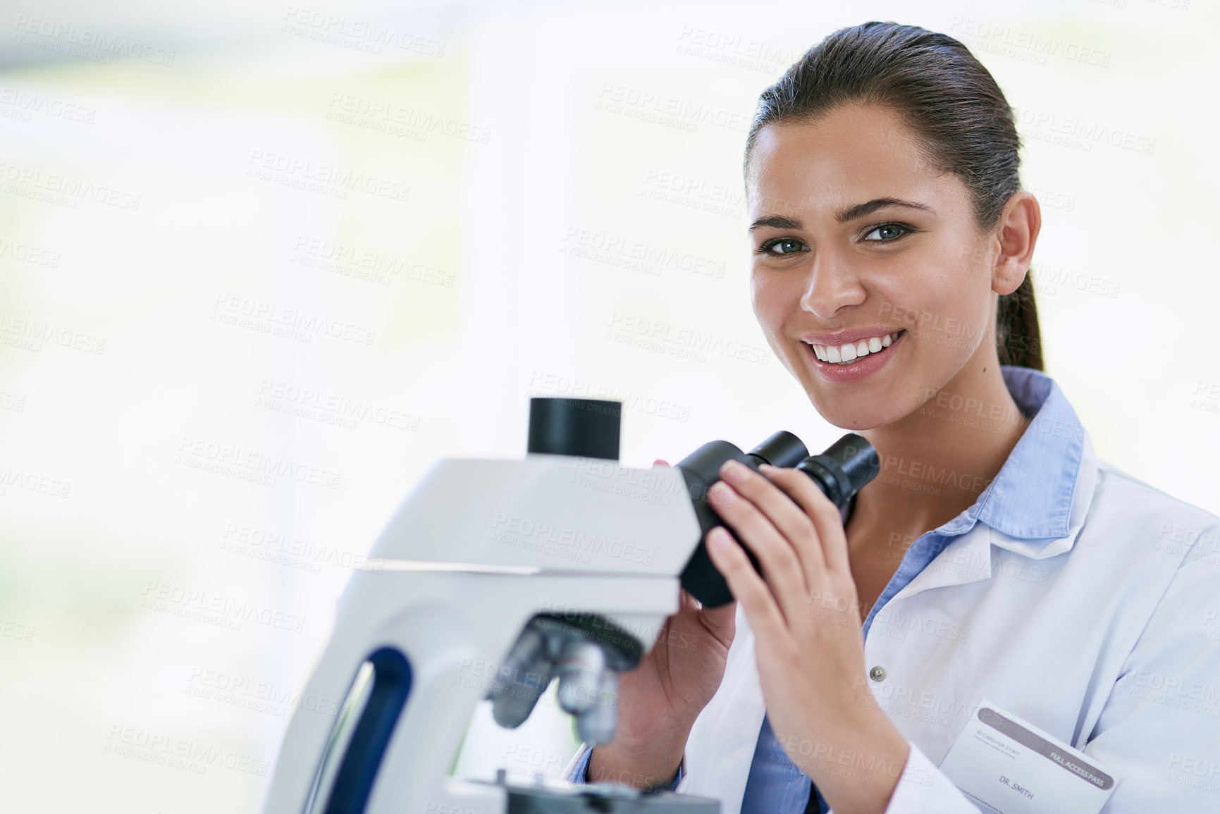 Buy stock photo Portrait of a young female scientist working in a lab