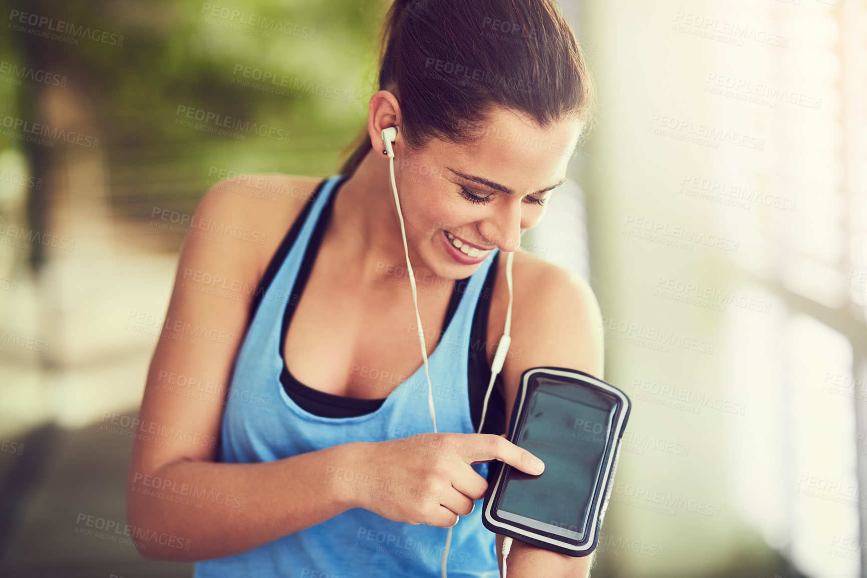 Buy stock photo Happy woman, fitness and earphones with phone for music, radio or podcast in workout, exercise or outdoor training. Female person, runner or smile with mobile smartphone for playlist, album or audio