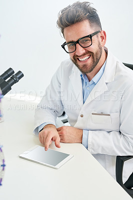 Buy stock photo Portrait of a male scientist working on a digital tablet in a lab