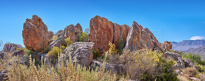 Buy stock photo Rock, blue sky and landscape in nature with plants, ecosystem or natural habitat creation in wallpaper. Boulder, bushes or sunshine in environment with dry climate, travel or stone in Arizona reserve