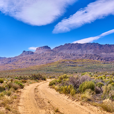 Buy stock photo Landscape, mountains and field with road in nature for environment, horizon and growth. Sustainability, plants and tourism with outdoor path for rocks, habitat conservation and hills background