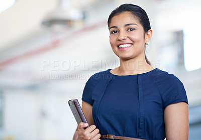 Buy stock photo Portrait of an attractive young businesswoman holding her journal while standing in an office