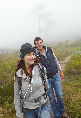 Buy stock photo Shot of a beautiful young woman out hiking with her boyfriend