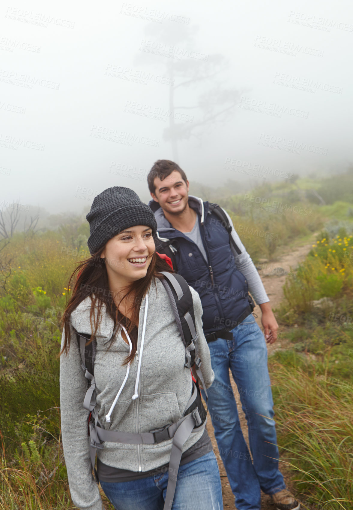 Buy stock photo Shot of a beautiful young woman out hiking with her boyfriend