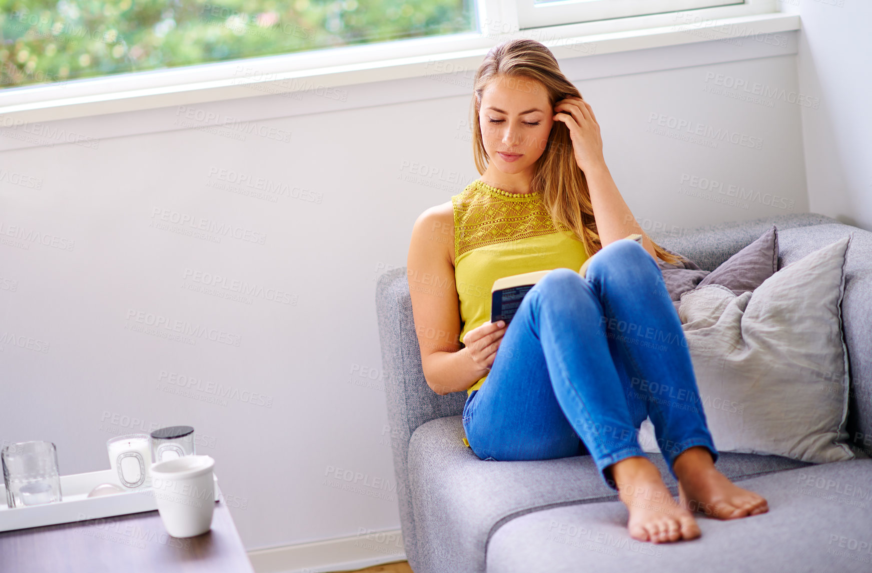 Buy stock photo Relax, reading books and woman on sofa in home for learning, knowledge and literacy on weekend. Literature, apartment and person with novel, story and fiction for hobby, peace and calm in living room