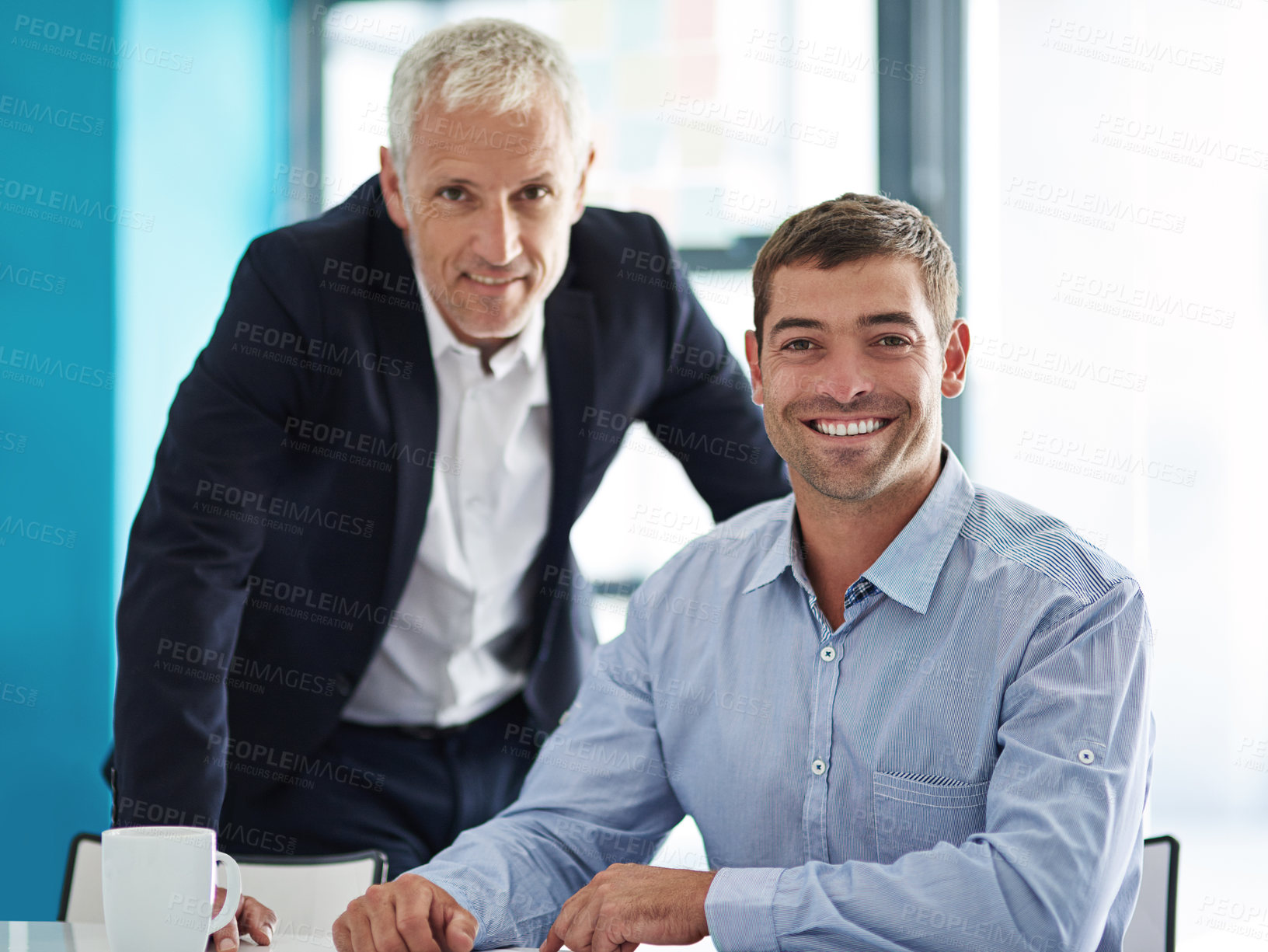 Buy stock photo Shot of two businesspeople having a discussion in a corporate office