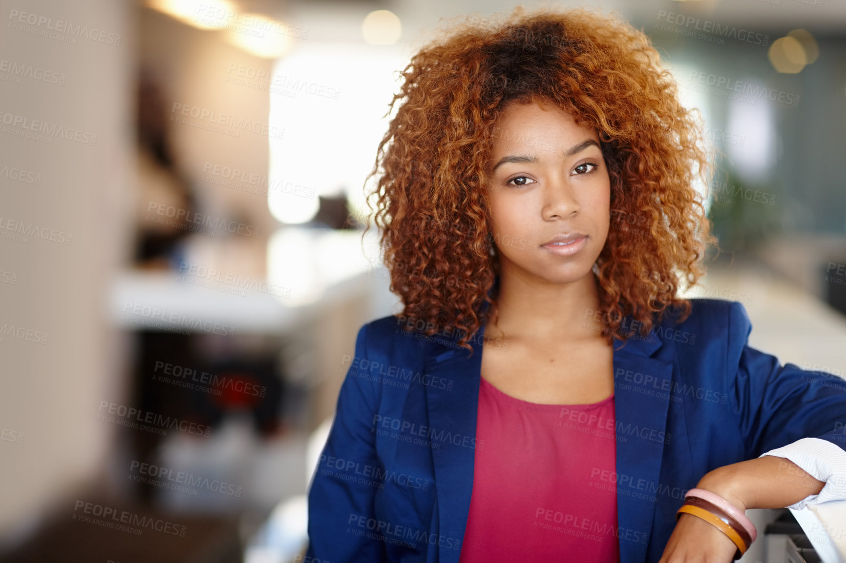 Buy stock photo Portrait of a confident young businesswoman standing in an office