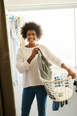 Buy stock photo Portrait, woman and laundry with smile, home and basket for cleaning, housekeeping and maintenance. Tidy, apartment and chores for domestic, container and african girl or housework, fresh and clothes