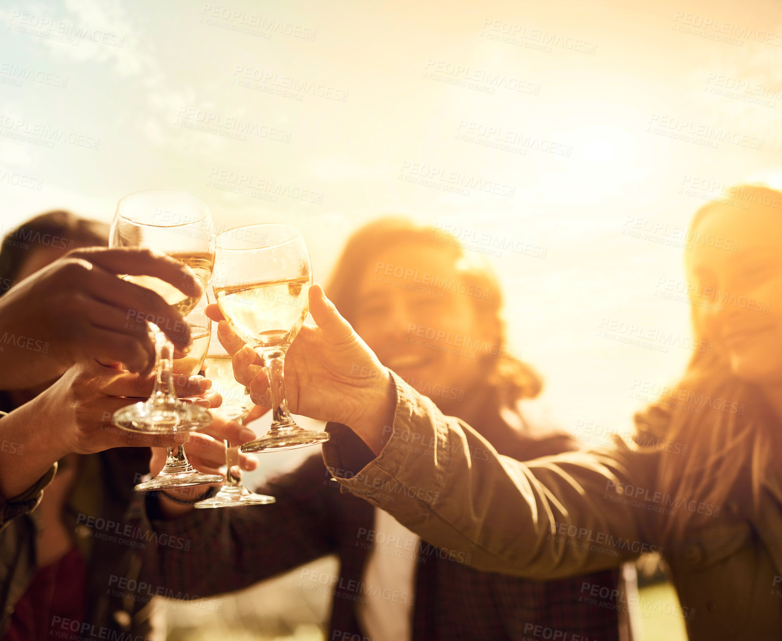 Buy stock photo Shot of a group of young friends having fun at a picnic