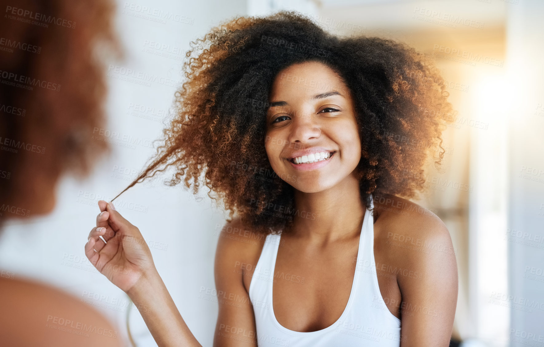 Buy stock photo Black woman, portrait and bathroom mirror for hair care or morning routine with shampoo, wellness or texture. Female person, face and curly afro in reflection for soft treatment, home or happiness