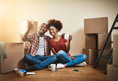 Buy stock photo Moving, selfie and couple in home with phone for social media, memory and relax in apartment. Happy, people and video call in new house with smartphone and smile for real estate, property and rent