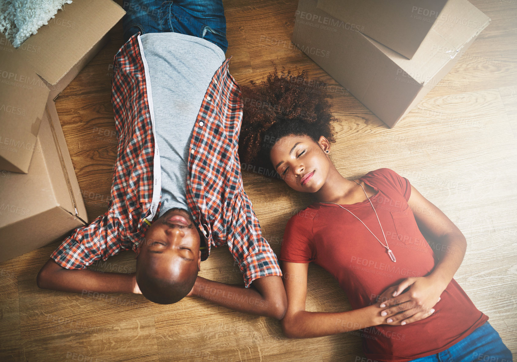 Buy stock photo Sleep, fatigue and black couple on floor in new home with cardboard boxes, tired and mortgage with high angle. Relax, exhausted man and woman in dream house with love, property investment and moving