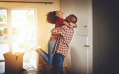 Buy stock photo Cropped shot of a young couple celebrating their move into a new home