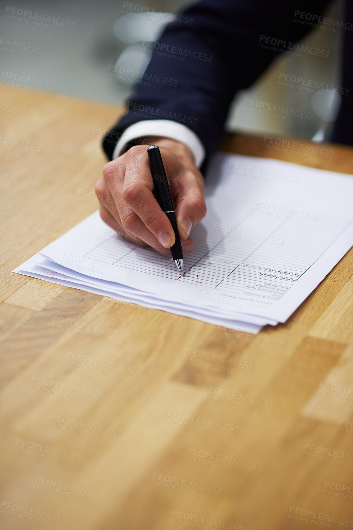 Buy stock photo Closeup shot of a businessman sitting at a table in an office going through a checklist