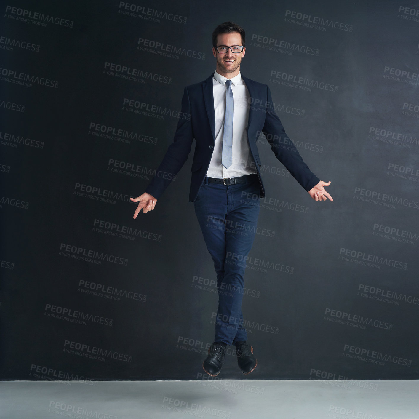 Buy stock photo Studio portrait of a businessman in mid air while ballet dancing