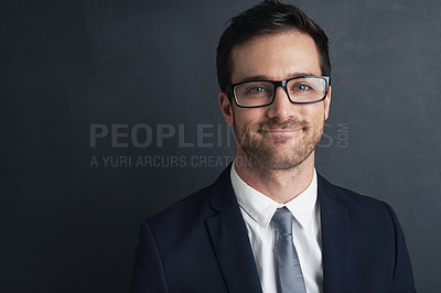 Buy stock photo Studio portrait of a smiling businessman in a suit and glasses