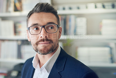 Buy stock photo Shot of a businessman working at his computer in an office