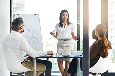 Buy stock photo Cropped shot of a businesswoman giving a presentation to her colleagues in an office