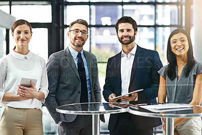 Buy stock photo Portrait of a group of colleagues standing together in an office
