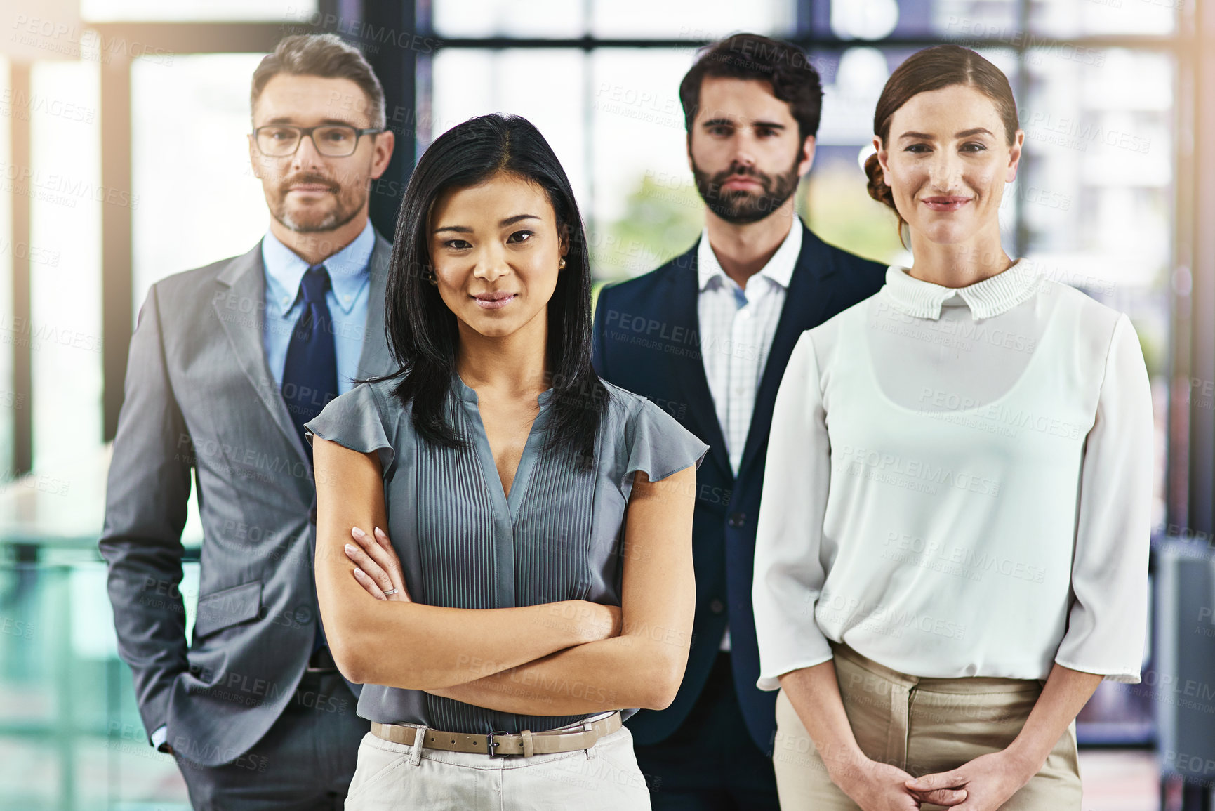 Buy stock photo Portrait of a group of colleagues standing together in an office