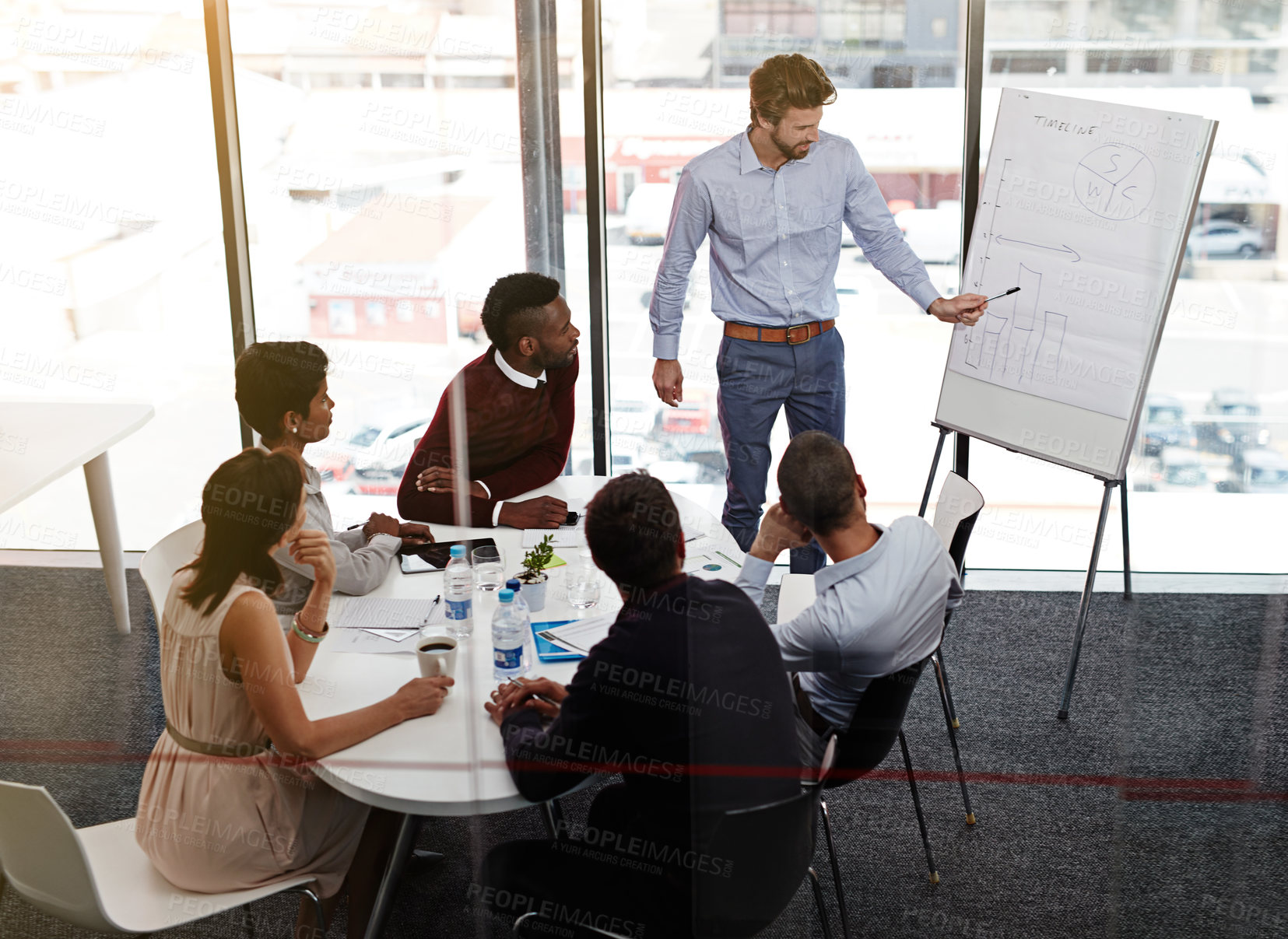 Buy stock photo Pointing, presentation and man with whiteboard, office and discussion of ai in UX design, people and boardroom. Business meeting, graphs and explaining of user research, creative and group in team
