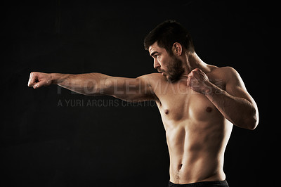 Buy stock photo Studio shot of a sporty young man against a dark background