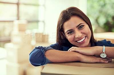 Buy stock photo Portrait of a young woman moving into her new home