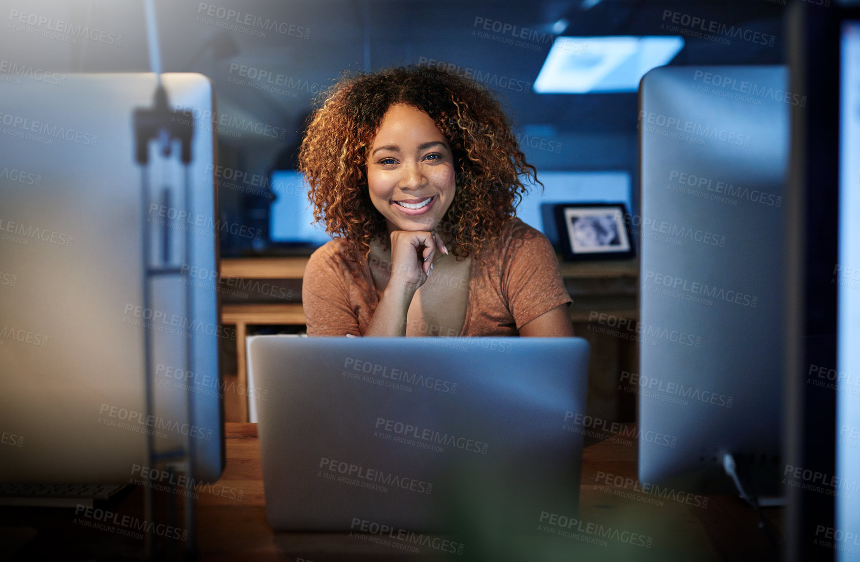 Buy stock photo Portrait of a young woman working late in an empty office