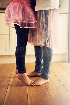 Buy stock photo Dad, man and kid with feet for dancing in home with help, trust or care for memory in living room. People, embrace and little girl with fun for bonding, hug and love in house with father or family