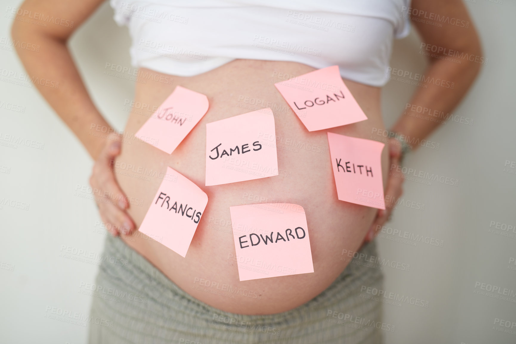 Buy stock photo Shot of an unidentifiable pregnant woman with adhesive notes stuck to her belly