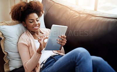 Buy stock photo Woman, browse and home or smile on tablet, relax and internet communication or social media scrolling. Reading, text and blog or online networking, typing and happy on tech on sofa in apartment