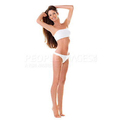 Buy stock photo Studio portrait of a beautiful young brunette woman in a white bikini with her hands in her hair isolated on white