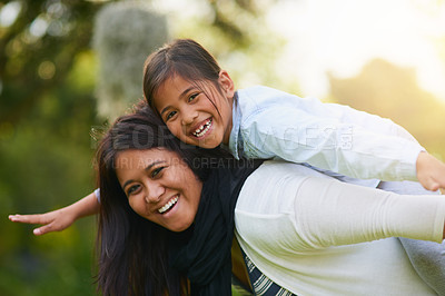 Buy stock photo Portrait of a mother and daughter enjoying the day outdoors together