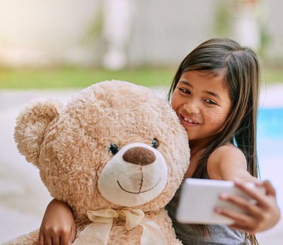 Buy stock photo Happy, outdoor and girl with teddy bear, selfie and comfortable with happiness at home garden. Toddler, child development and love with fluffy toy gift outside for hugging, cozy picture and comfort