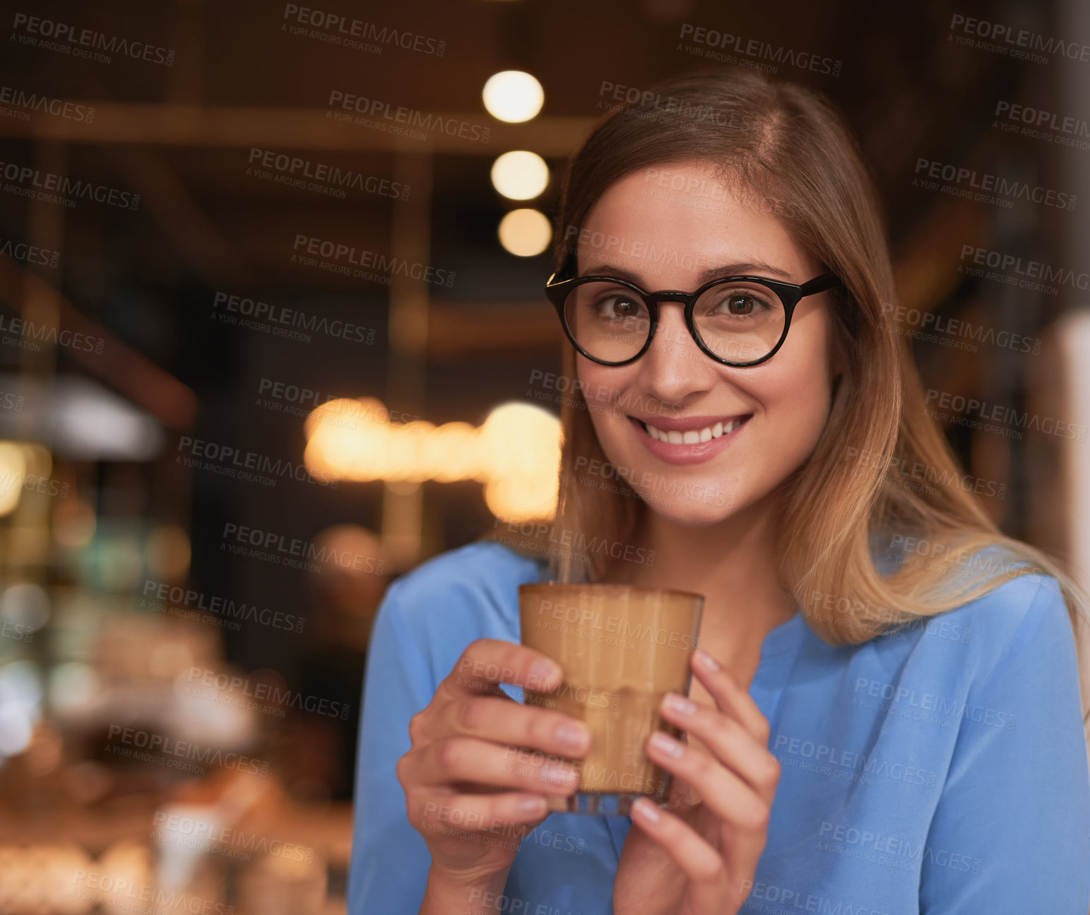 Buy stock photo Cropped portrait of an attractive young woman sitting in a coffee shop
