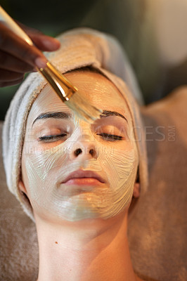 Buy stock photo Shot of a young woman receiving a beauty treatment in a spa