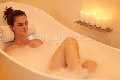 Buy stock photo High angle shot of an attractive young woman taking a bubble bath