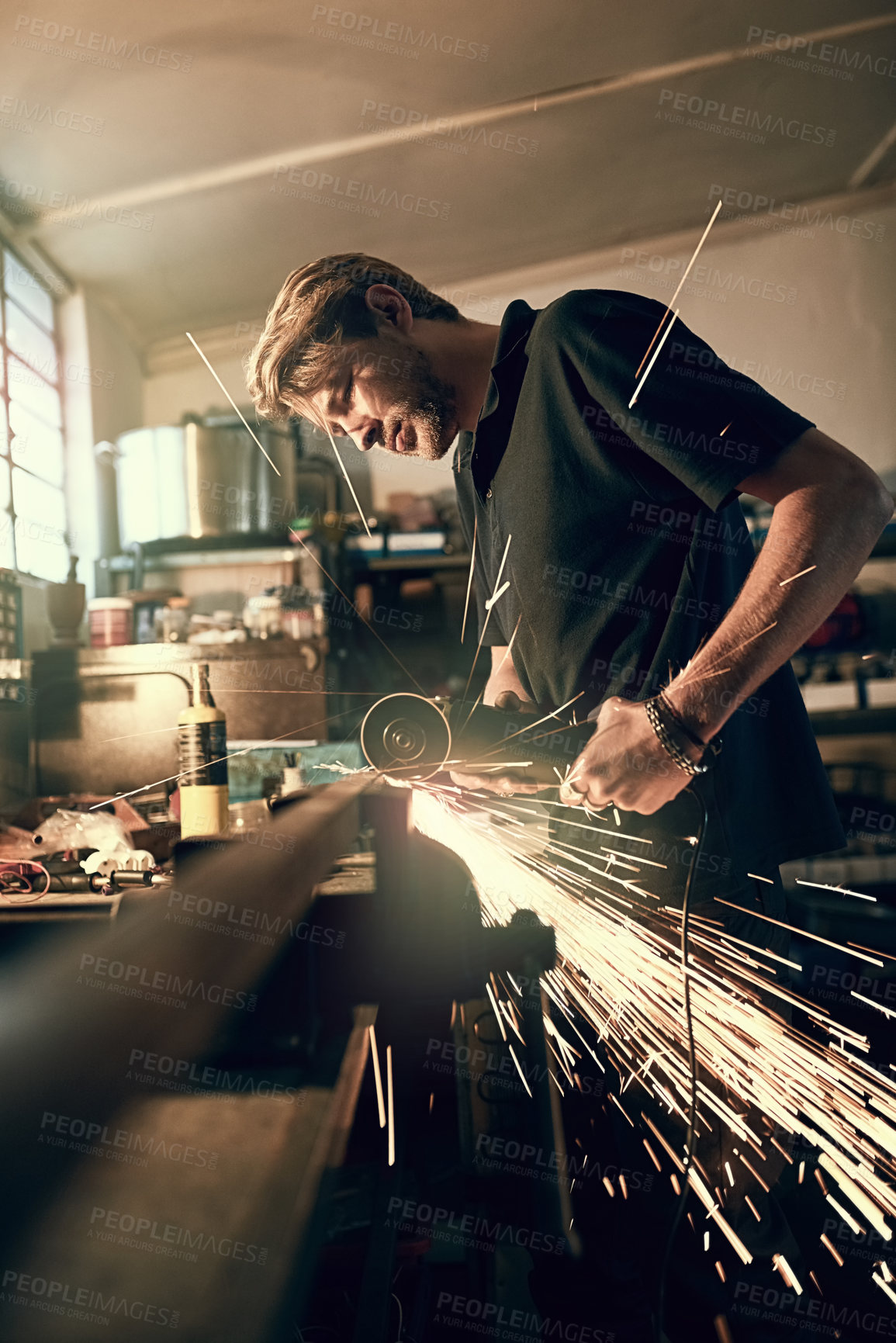 Buy stock photo Handyman, sparks and tools for welding or cutting metal at night in workshop with angle grinder. Home renovation, creativity and construction worker or carpenter with repair or project in garage