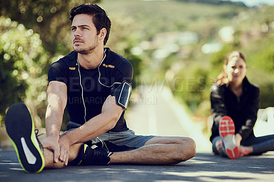 Buy stock photo Full length shot of two young people warming up outdoors before a workout