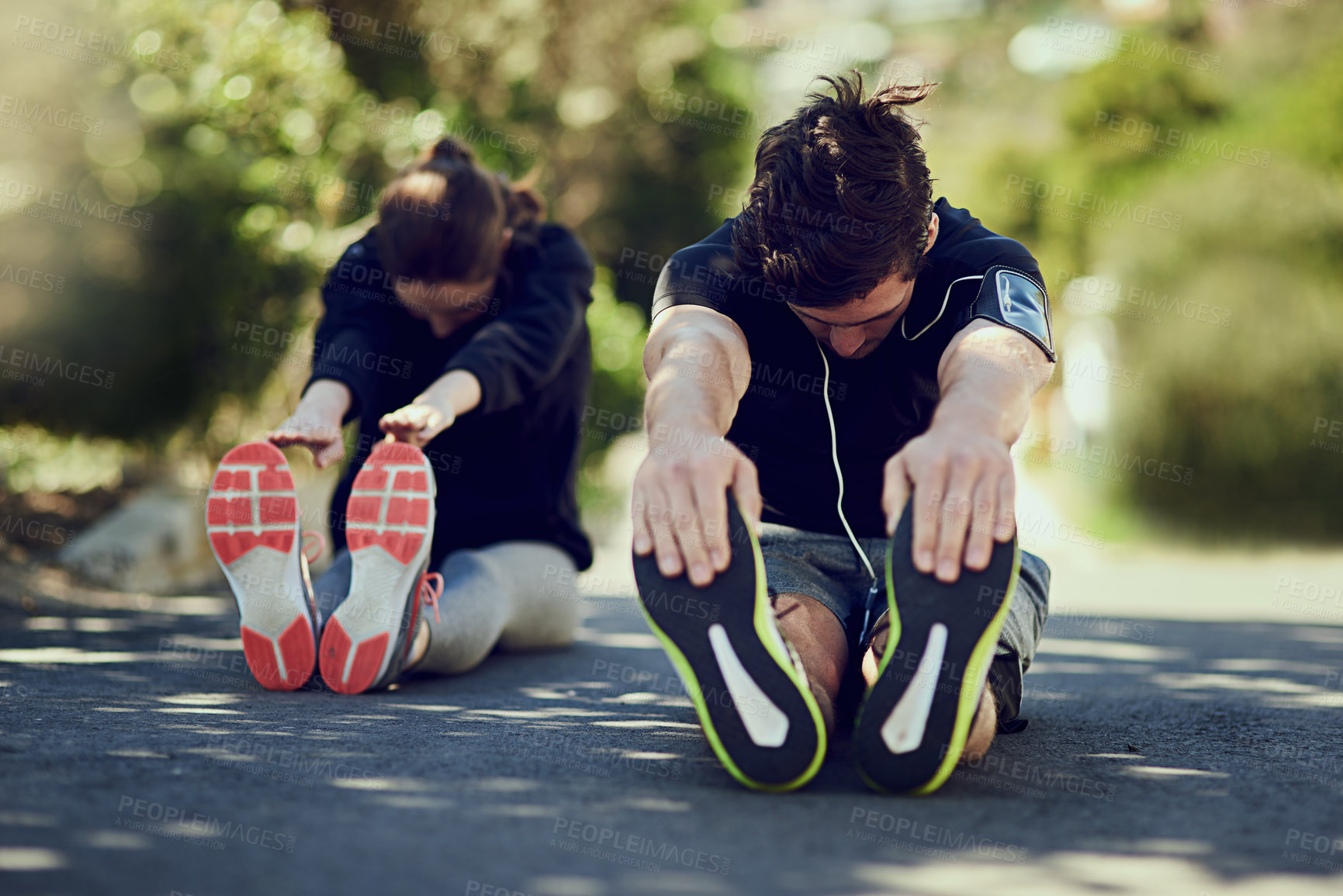 Buy stock photo Couple, stretching legs and runner before fitness, exercise and workout on road outdoor. People, man and woman with warm up for health, wellness and flexibility with endurance for motivation